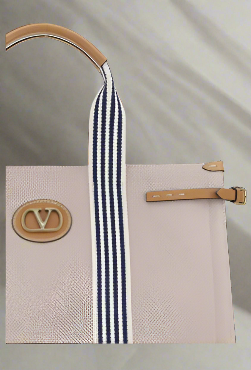 Valentino Garavani women's designer handbag in leather Luxury Valentino Garavani shoulder bag with iconic studs Valentino Garavani crossbody bag in black with gold accents