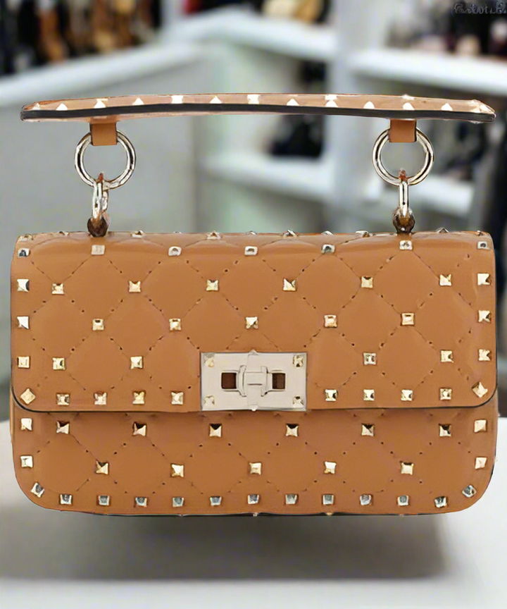 Valentino Garavani women's designer handbag in leather Luxury Valentino Garavani shoulder bag with iconic studs Valentino Garavani crossbody bag in black with gold accents