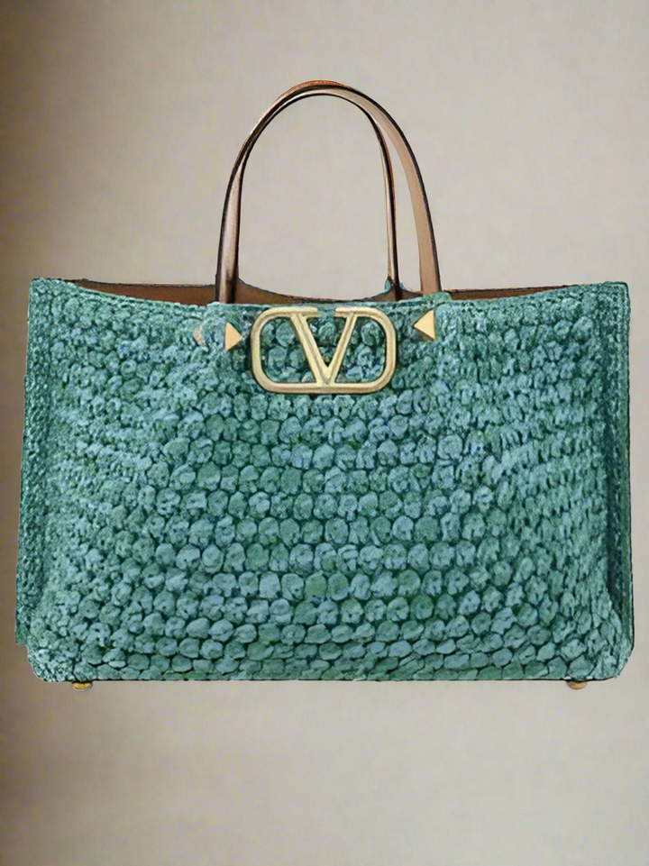 Valentino Garavani women's designer handbag in leather Luxury Valentino Garavani shoulder bag with iconic studs Valentino Garavani crossbody bag in black with gold accents