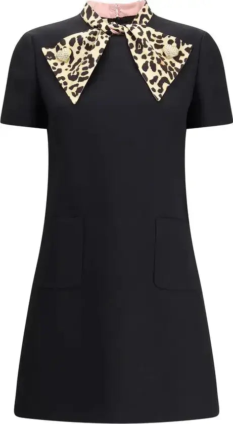 Black dress with leopard print collar on a white background