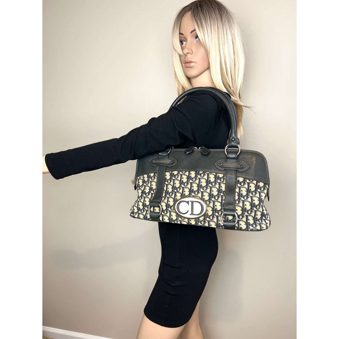 Woman modeling CHRISTIAN DIOR Monogram Trotter CD Blue Canvas Hand Bag, showcasing luxury bags style.