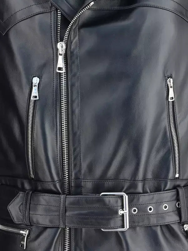 Close-up of a black leather jacket with zippers and a belt.