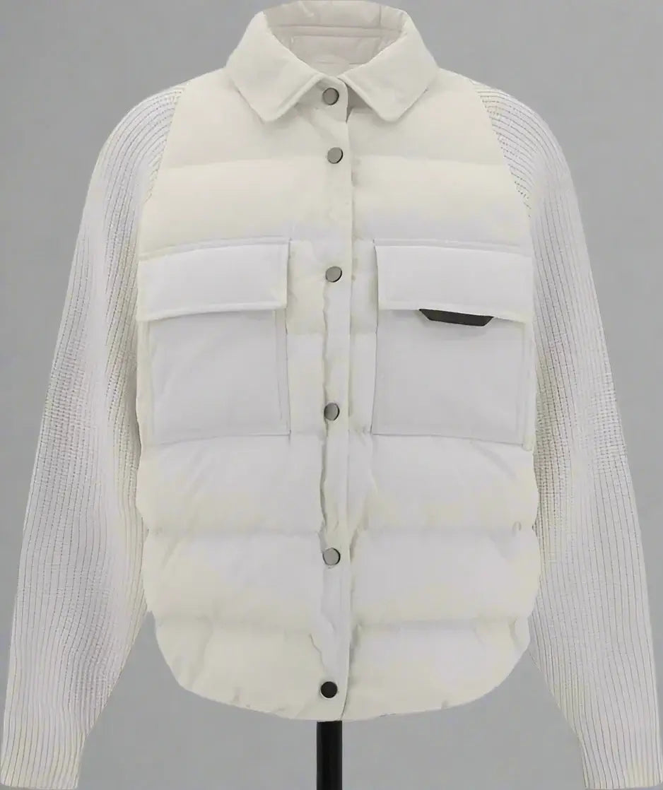 Light gray puffer jacket with ribbed sleeves on a white background