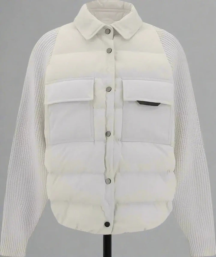 Light gray puffer jacket with ribbed sleeves on a white background