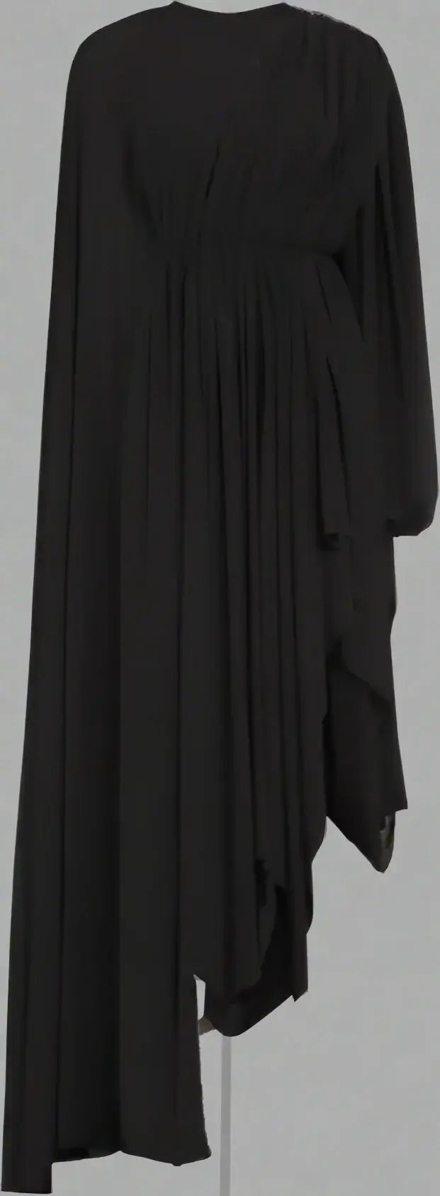 Black draped dress on a white background