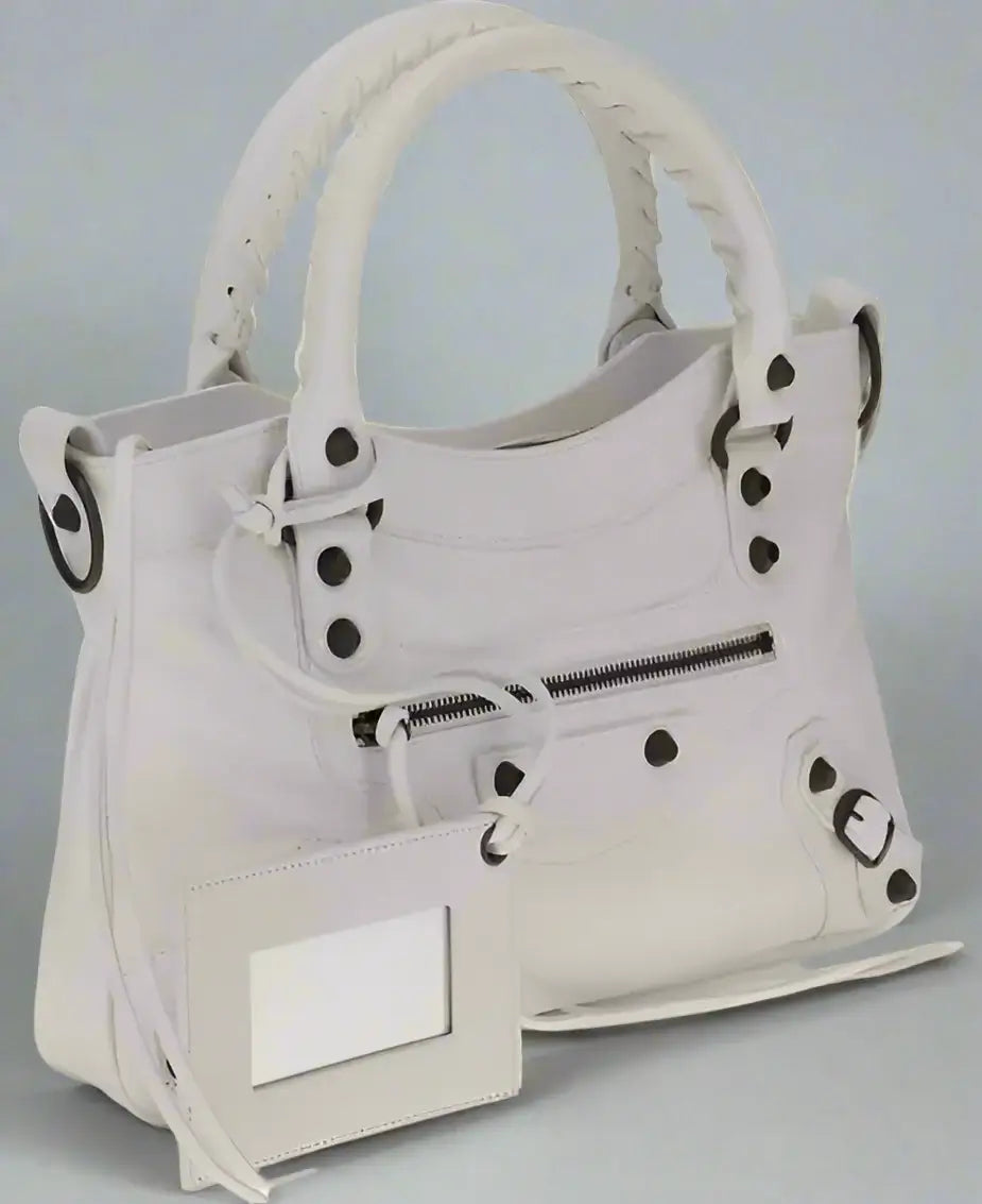 White handbag with black accents on a white background