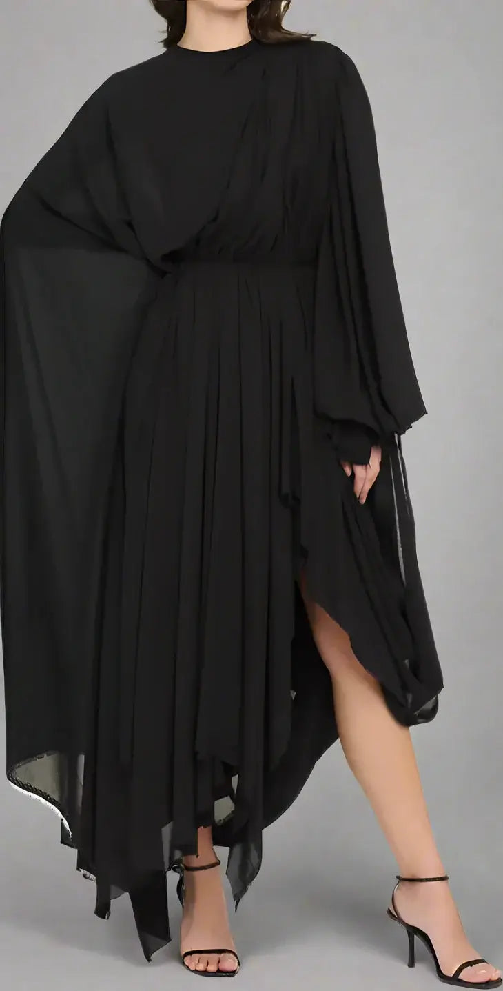 Black dress with flowing sleeves and hem on a white background