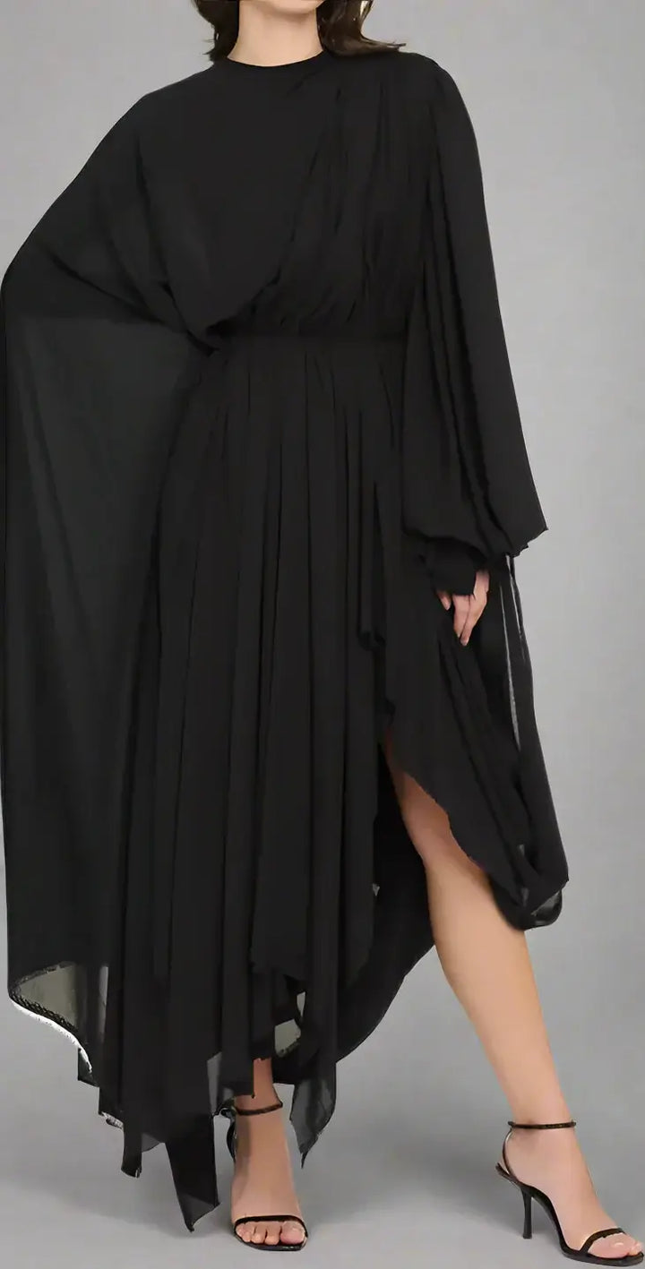 Black dress with flowing sleeves and hem on a white background