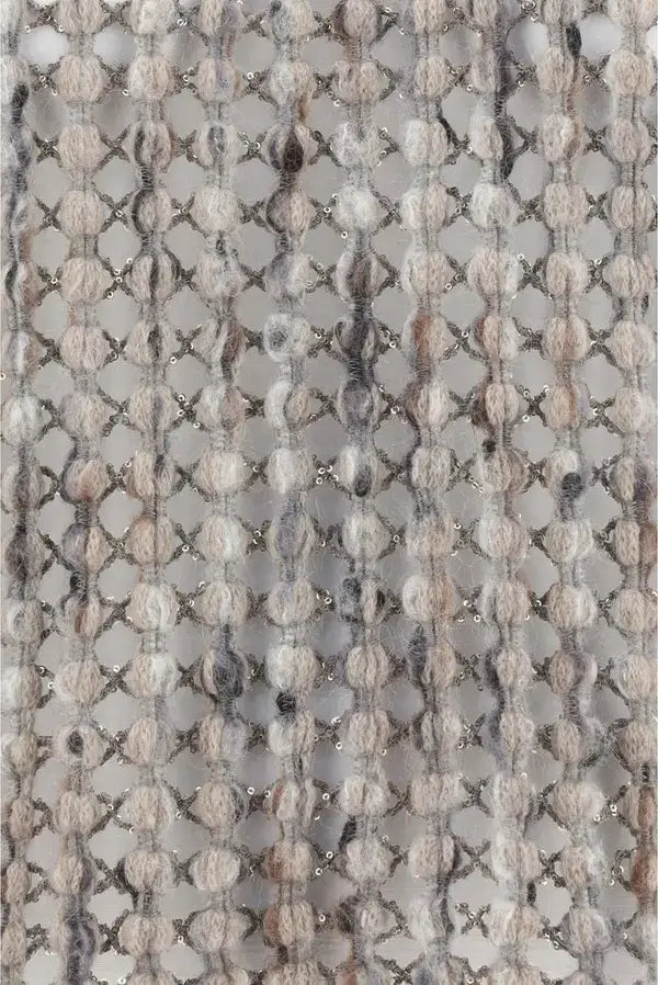 Close-up of a textured fabric with a geometric pattern