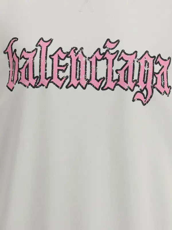 Balenciaga logo in pink on a light gray background
