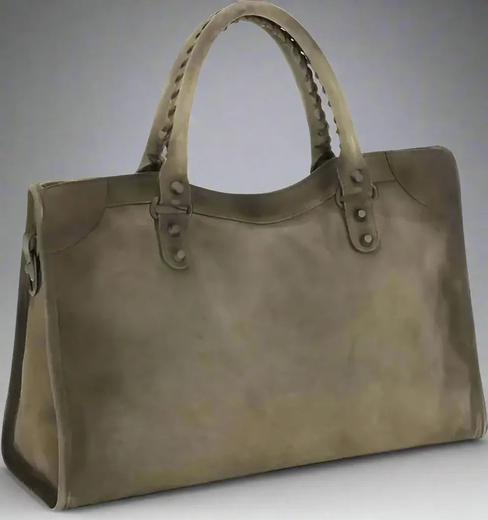 Green handbag with braided handle on a white background