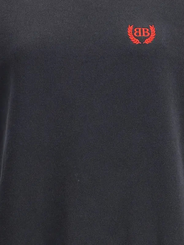 Black t-shirt with a red logo on the chest