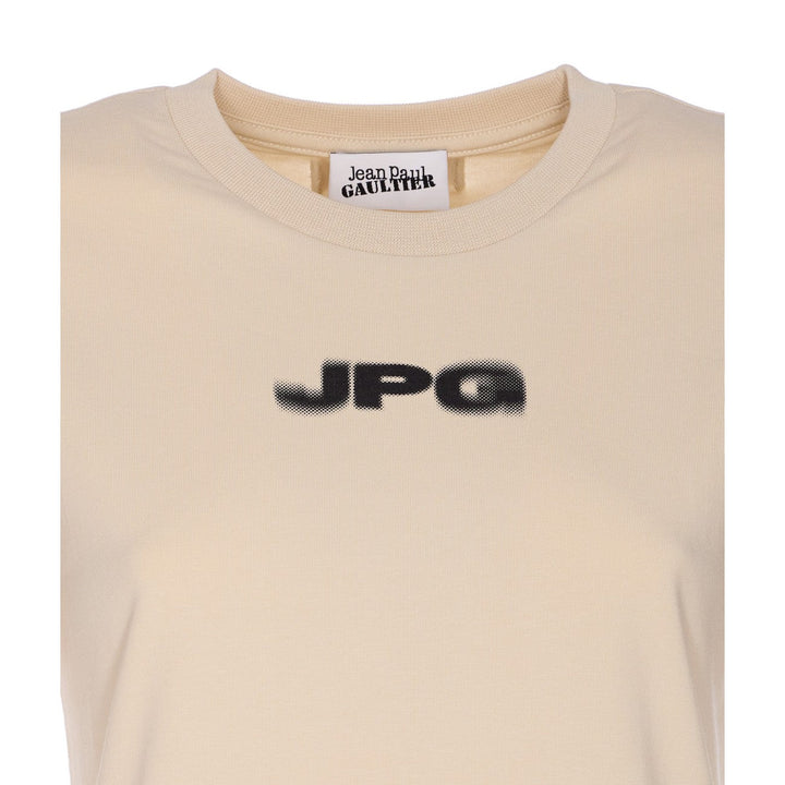 Beige t-shirt with 'JPG' logo and 'Jean Paul Gaultier' label on a white background