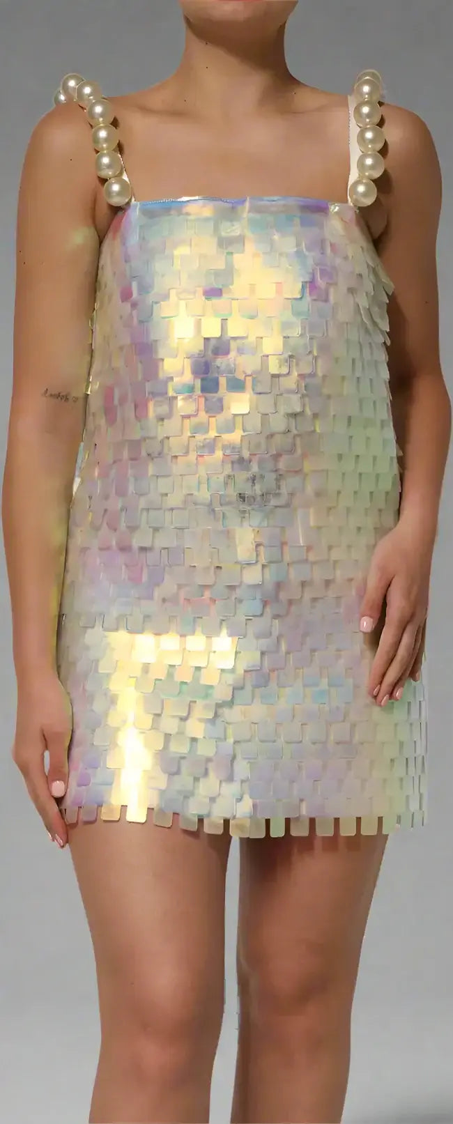 Iridescent sequin dress with pearl straps worn by a model