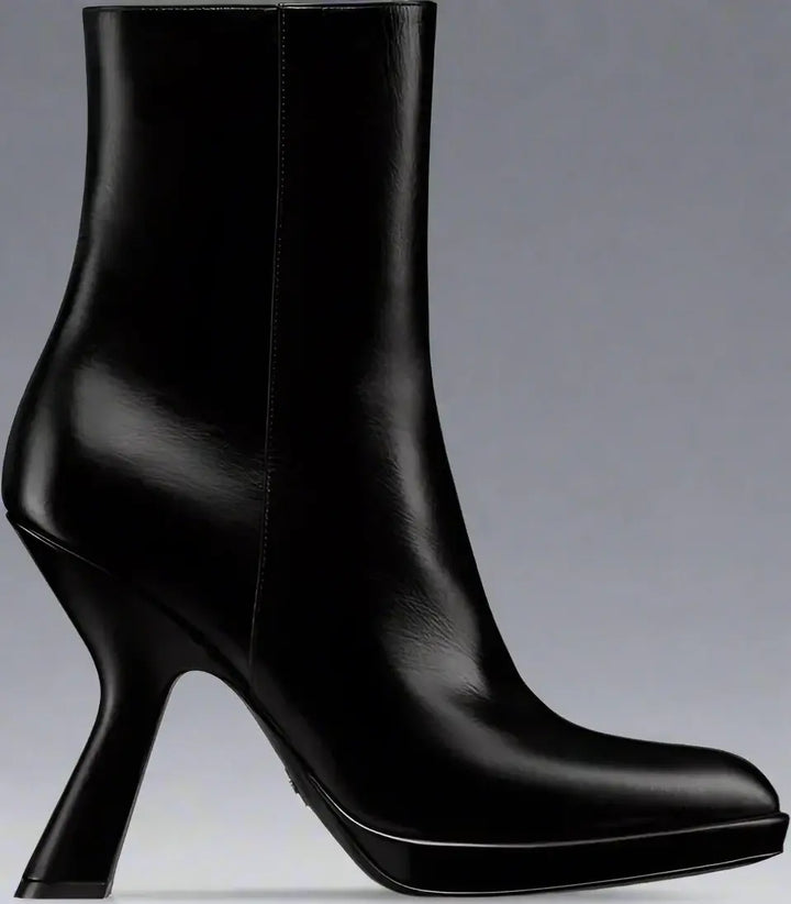 Black high-heeled ankle boots on a white background