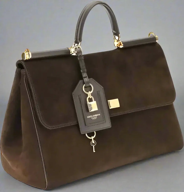 Brown handbag with a tag on a white background