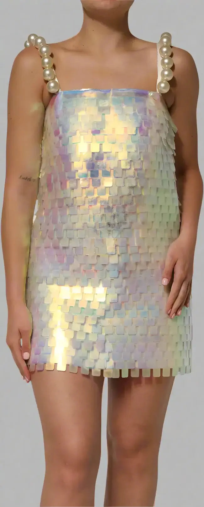 Iridescent sequin dress with pearl straps worn by a model