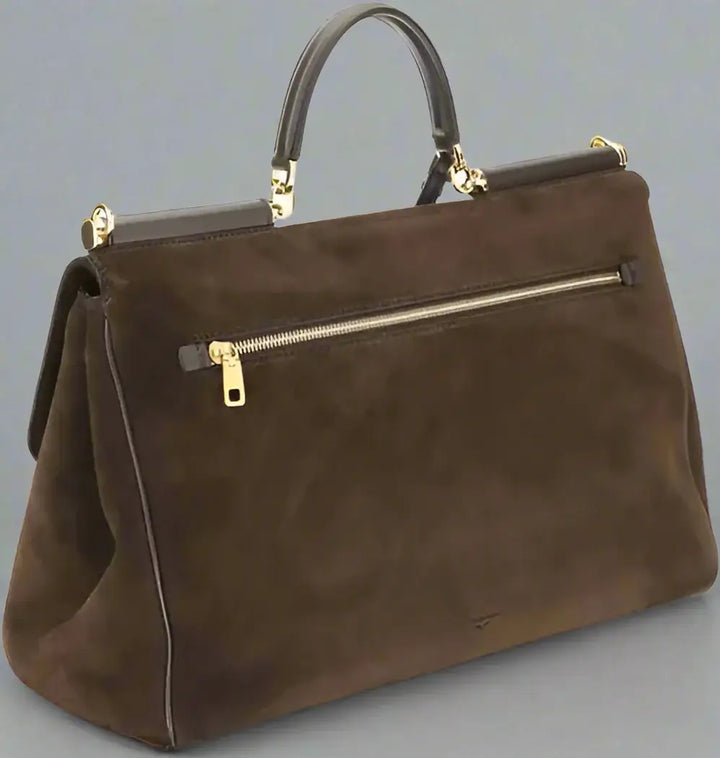 Brown handbag with gold zipper on a white background