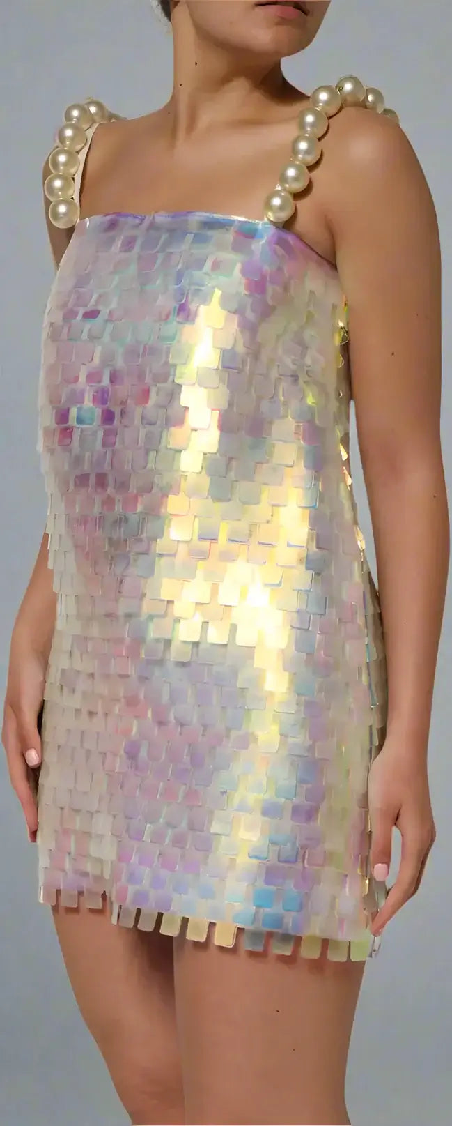 Iridescent sequin dress with pearl shoulder straps worn by a model.