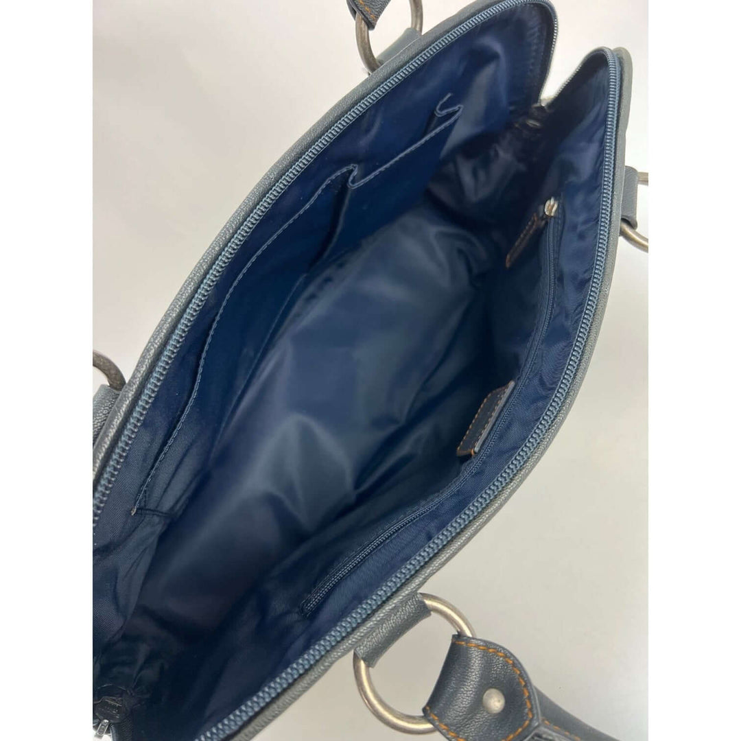 Interior view of CHRISTIAN DIOR Monogram Trotter CD Blue Canvas Hand Bag showcasing navy nylon lining and compartments.