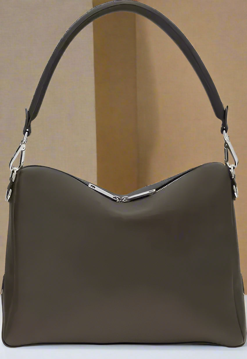 Brown handbag with a shoulder strap on a white background
