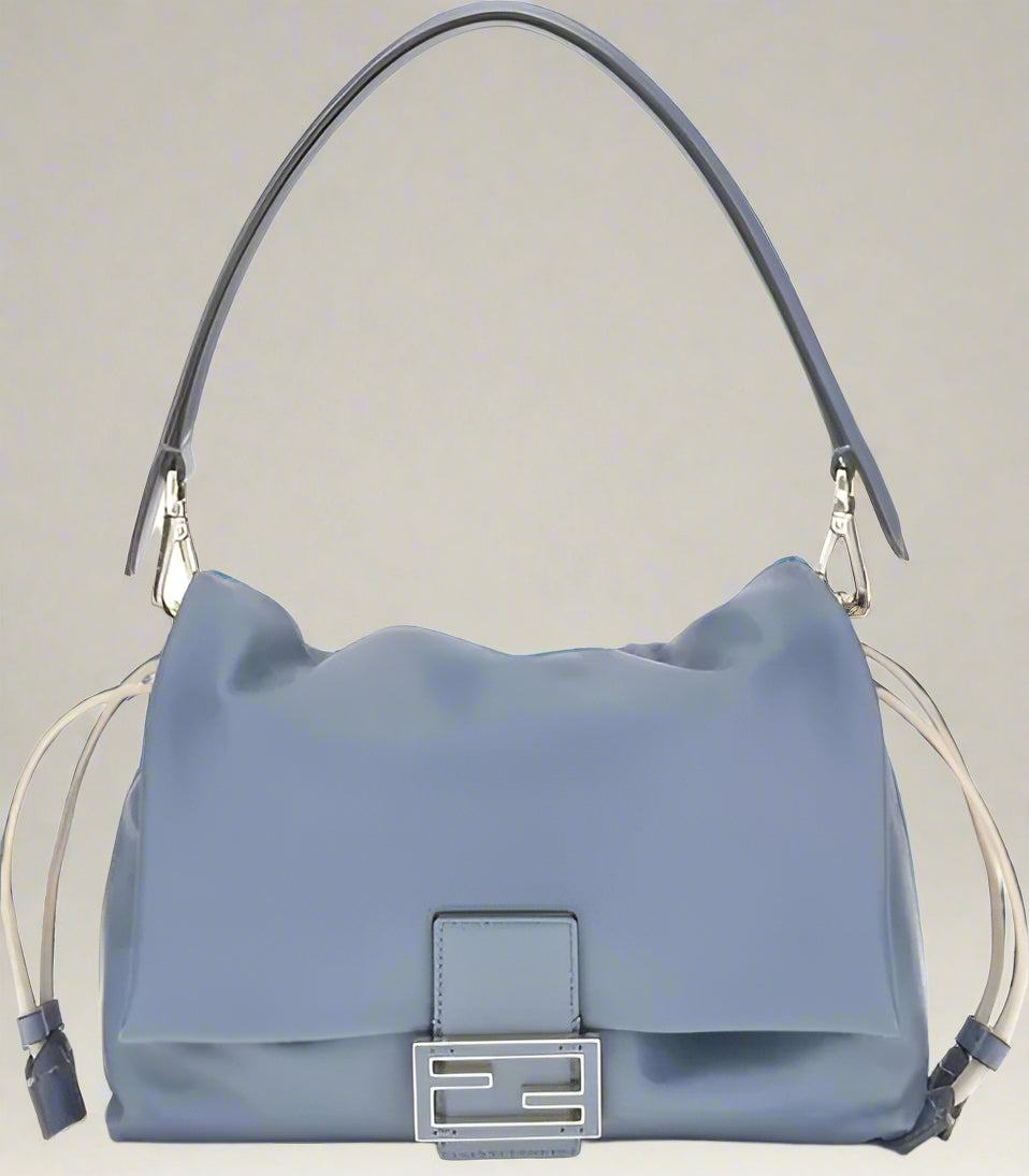 Blue handbag with a silver clasp on a white background
