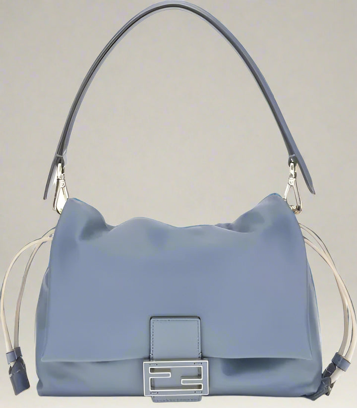 Blue handbag with a silver clasp on a white background