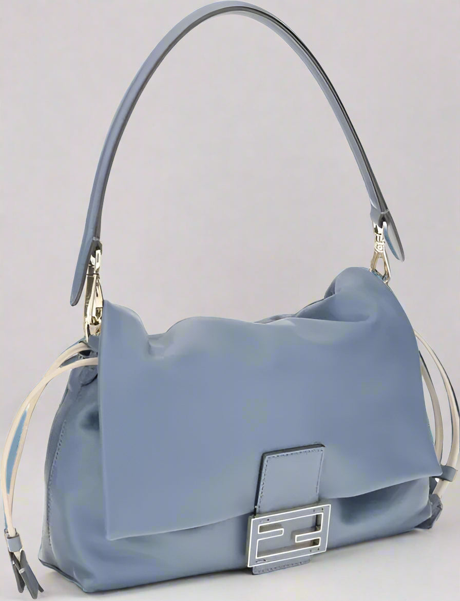 Blue handbag with a silver clasp on a white background