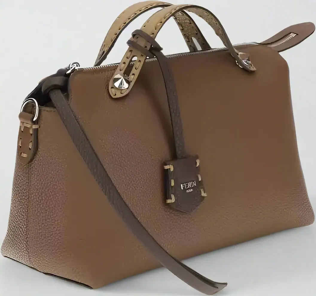 Brown leather handbag with a visible brand logo on a white background