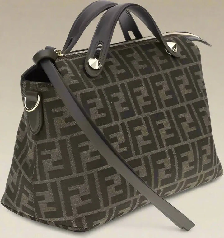 Designer handbag with a distinctive pattern on a white background
