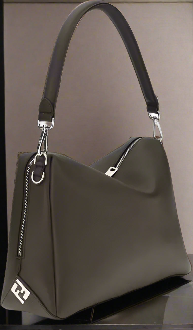 Black handbag with a visible brand logo on a white background