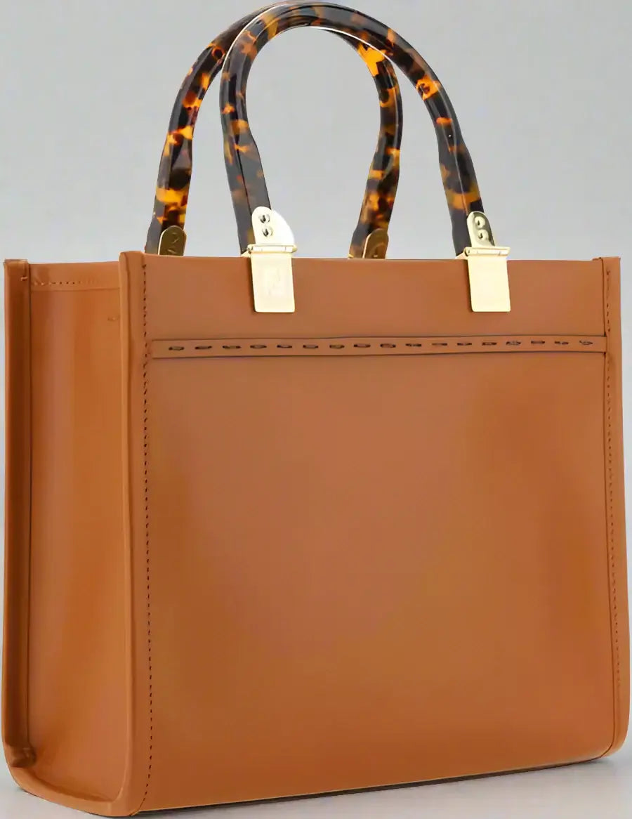 Brown handbag with tortoiseshell handles on a white background