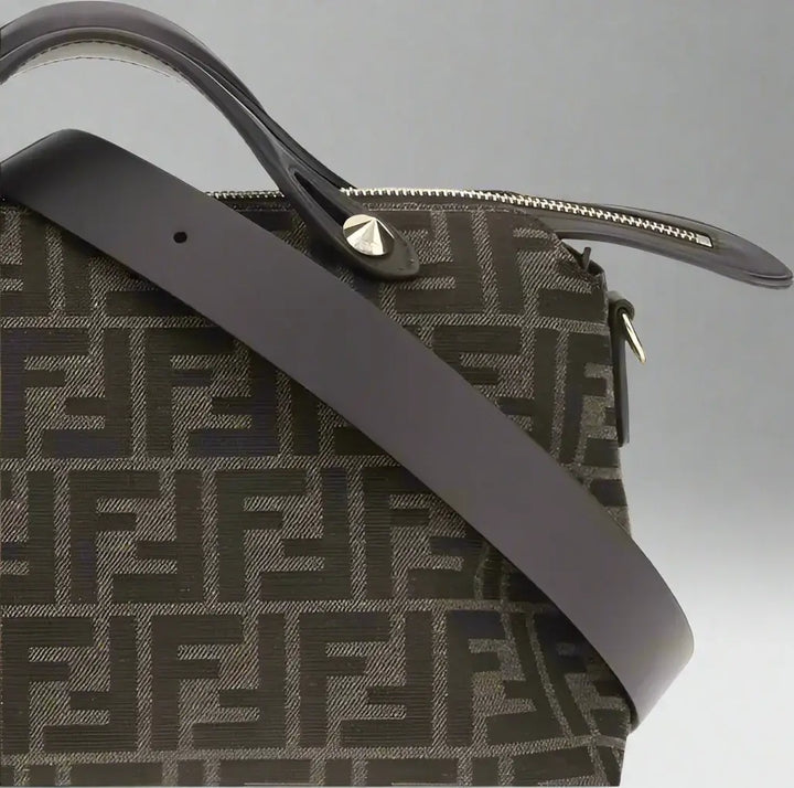 Designer handbag with a prominent brand logo on a white background