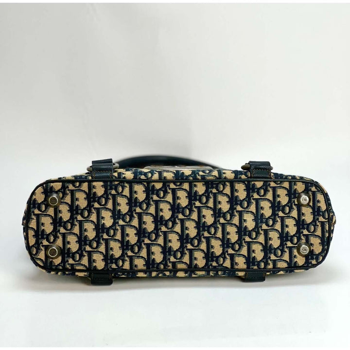 Bottom view of CHRISTIAN DIOR Monogram Trotter CD Blue Canvas Hand Bag showcasing the luxurious pattern and design.