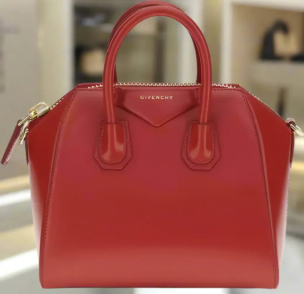 Red Givenchy handbag on a white background