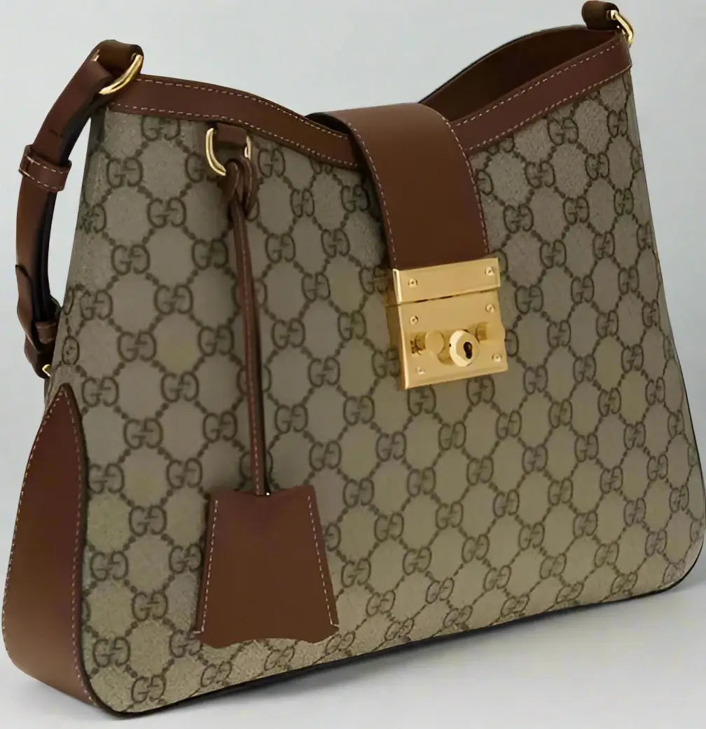 Designer handbag with brown and beige pattern on a white background