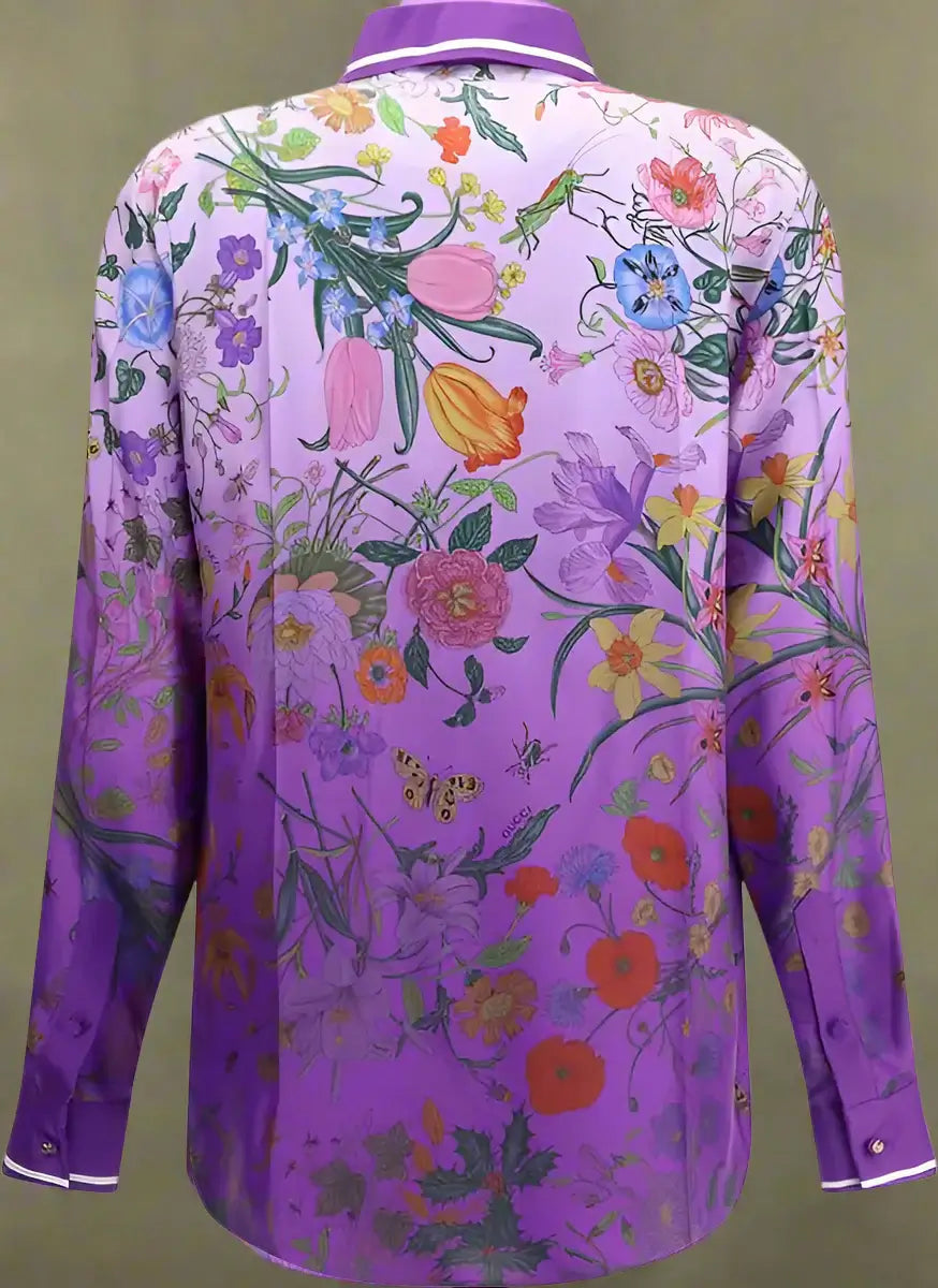 Purple floral shirt with colorful flowers and leaves on a white background
