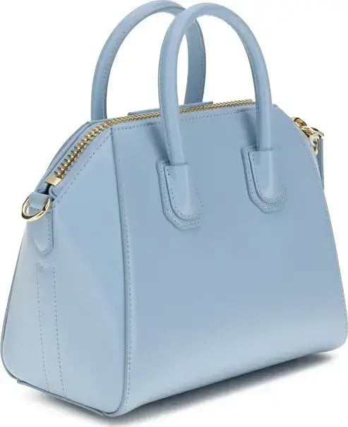 Light blue handbag with gold accents on a white background