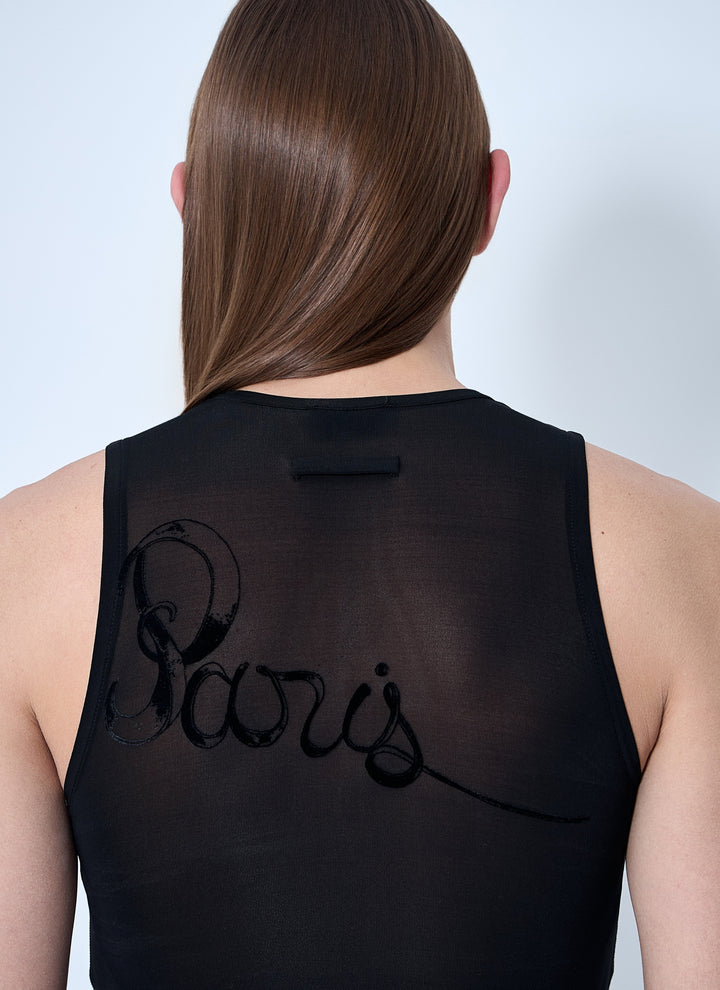 Black sleeveless top with 'Beavis' text on the back, worn by a person against a light gray background.