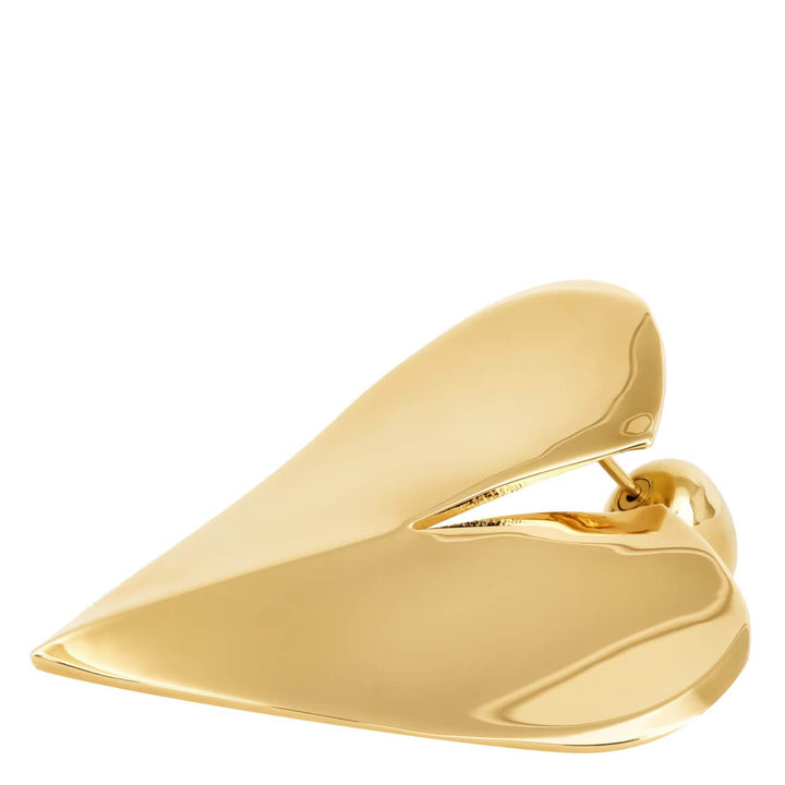 Gold high-heeled shoe on a white background