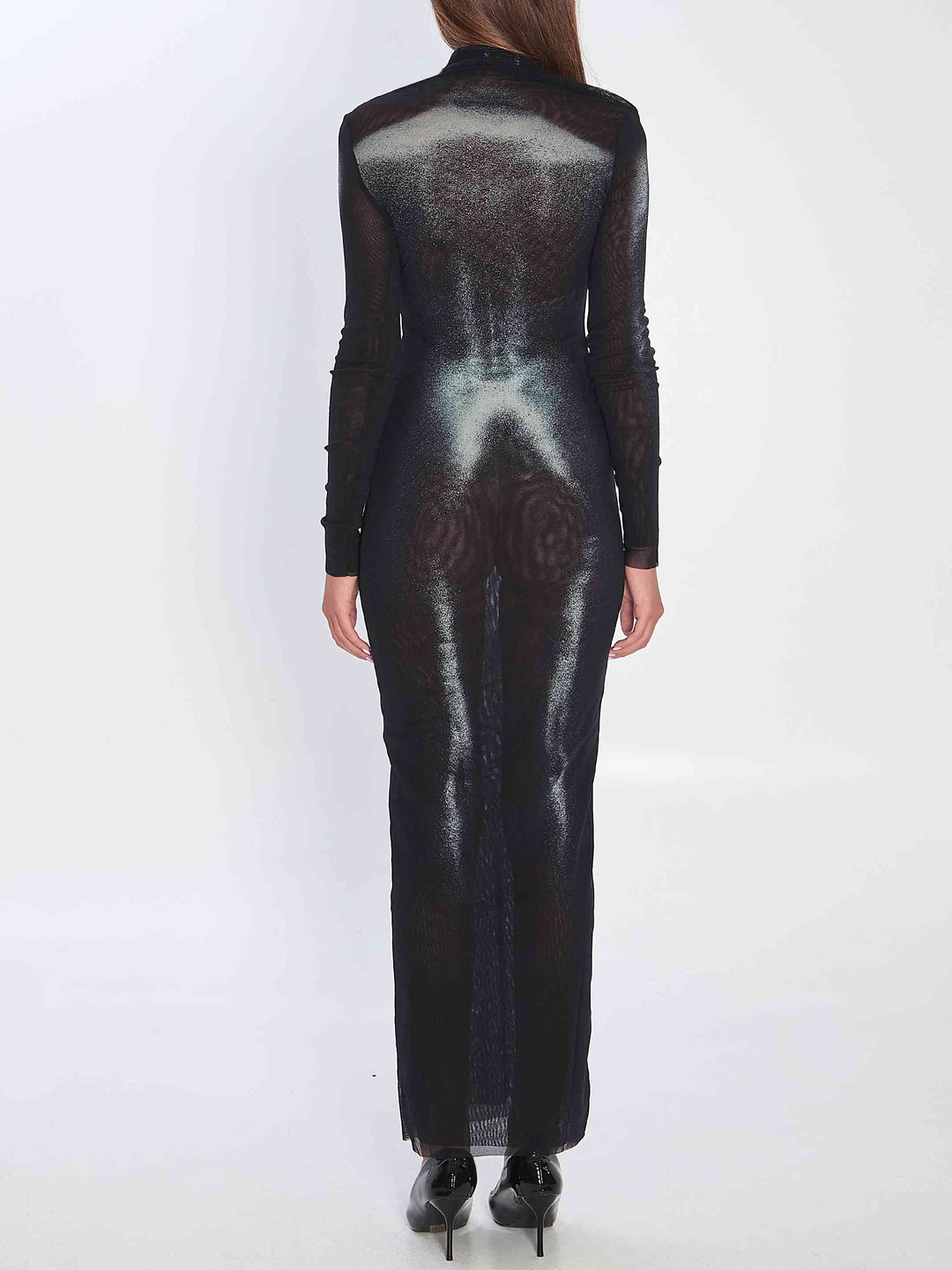 Black sheer dress with intricate design on a white background
