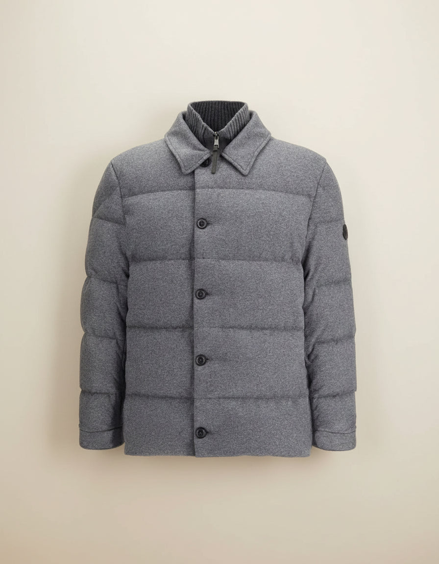 Gray puffer jacket with button details on a white background