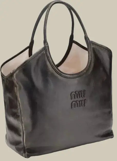 Black handbag with a visible brand logo on a white background