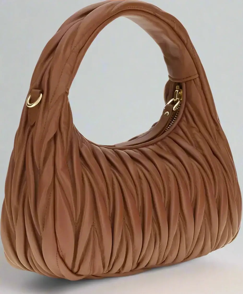 Brown textured handbag on a white background