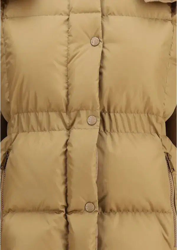 Close-up of a beige puffer jacket with buttons