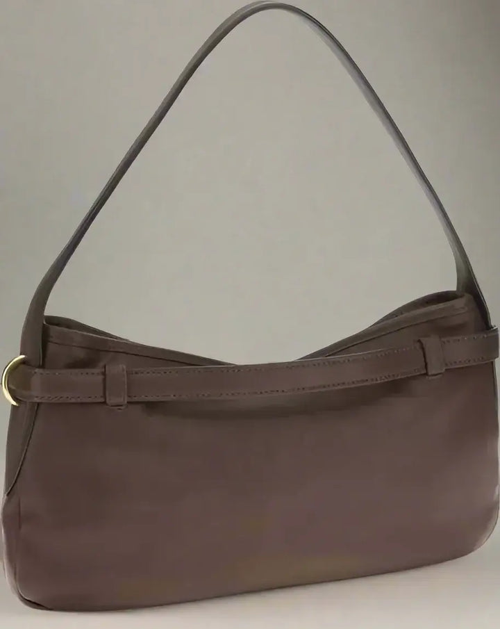 Brown handbag with a strap on a white background