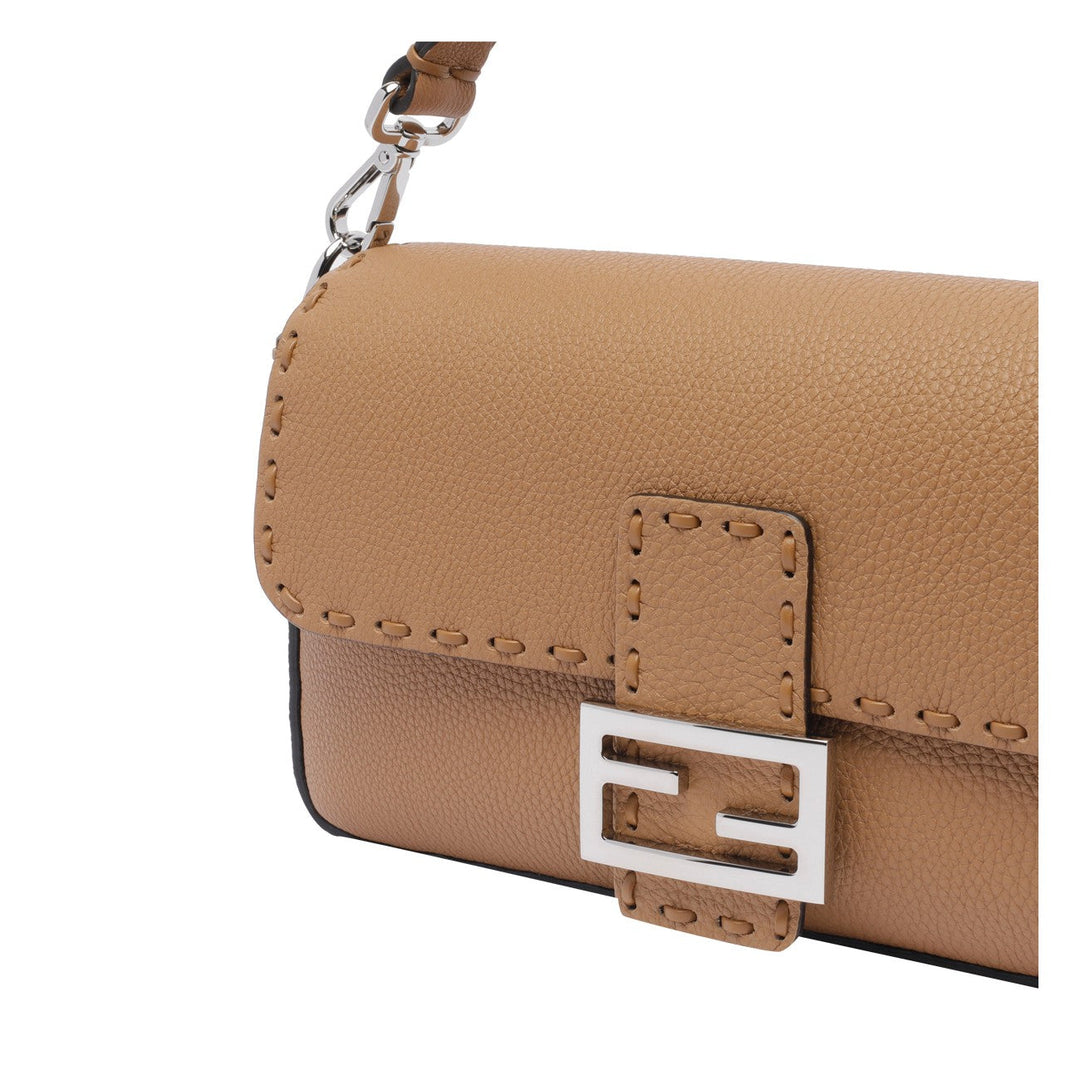 Brown leather handbag with a silver logo on a white background
