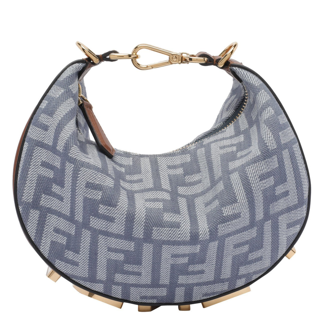 Designer handbag with distinctive pattern on a white background
