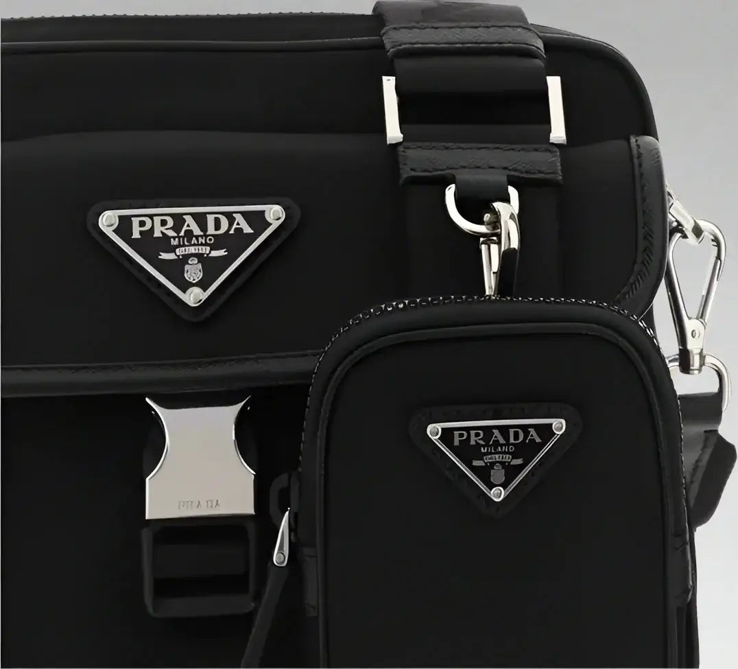 Black Prada bag with silver hardware on a white background