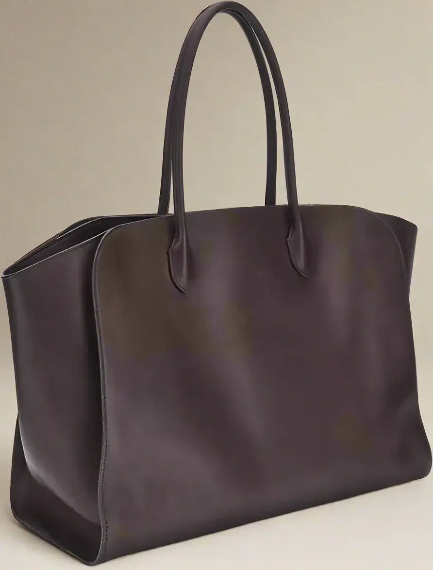 Brown leather tote bag with handles on a white background